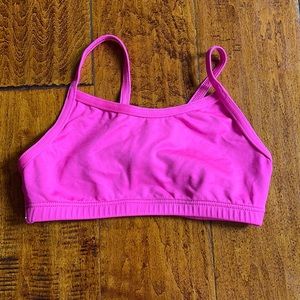 Child’s dance bra top. Bright pink with crossing straps. Perfect condition.
